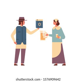 jews couple holding bible book and jug jewish man woman in traditional clothes standing together happy hanukkah judaism religious holidays concept full length vector illustration