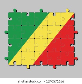 Jigsaw puzzle of Congo flag in diagonal of green, yellow and red. Concept of Fulfillment or perfection.