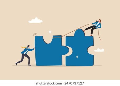 Jigsaw puzzle connection, teamwork partnership to help solve problem or challenge, cooperation or brainstorm to fit and match jigsaw pieces concept, businessman and woman help connect jigsaw puzzle.