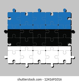Jigsaw puzzle of Estonia flag in horizontal triband of blue black and white. Concept of Fulfillment or perfection.
