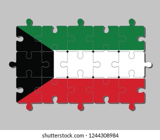 Jigsaw puzzle of Kuwait flag in green white and red color with black trapezium based on the hoist side. Concept of Fulfillment or perfection.