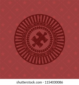 jigsaw puzzle piece icon inside red emblem