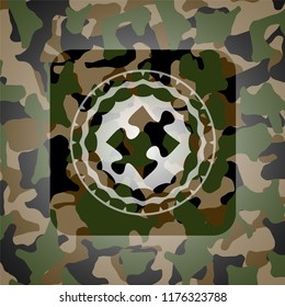 jigsaw puzzle piece icon inside camo emblem