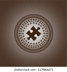 jigsaw puzzle piece icon inside badge with wooden background