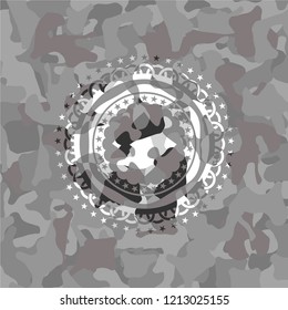 jigsaw puzzle piece icon inside grey camo emblem