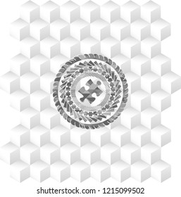 jigsaw puzzle piece icon inside grey emblem with geometric cube white background