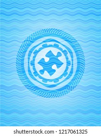 jigsaw puzzle piece icon inside water representation emblem.