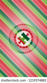 jigsaw puzzle piece icon inside christmas colors style badge.