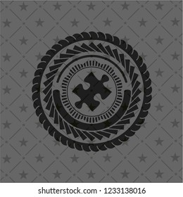 jigsaw puzzle piece icon inside realistic black emblem