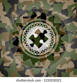 jigsaw puzzle piece icon inside camo texture