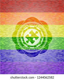 jigsaw puzzle piece icon inside emblem on mosaic background with the colors of the LGBT flag