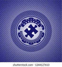 jigsaw puzzle piece icon inside emblem with denim high quality background
