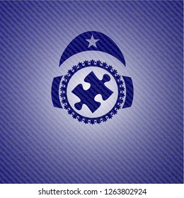jigsaw puzzle piece icon inside emblem with jean high quality background