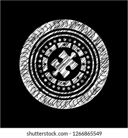 jigsaw puzzle piece icon inside chalkboard emblem