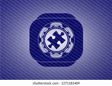 jigsaw puzzle piece icon inside badge with jean texture
