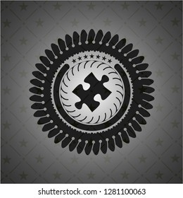 jigsaw puzzle piece icon inside dark badge or emblem