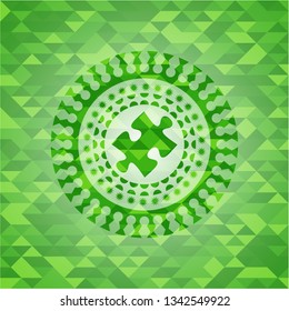 jigsaw puzzle piece icon inside green emblem with mosaic ecological style background