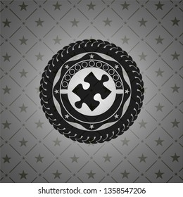 jigsaw puzzle piece icon inside realistic dark emblem