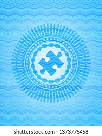 jigsaw puzzle piece icon inside light blue water wave emblem background.