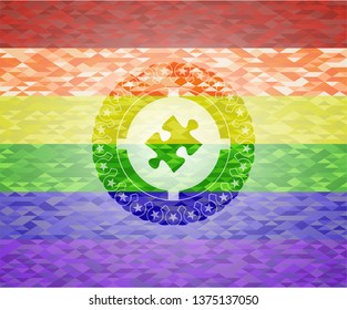 jigsaw puzzle piece icon inside emblem on mosaic background with the colors of the LGBT flag