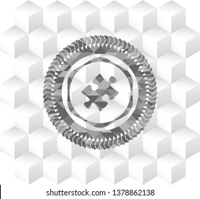 jigsaw puzzle piece icon inside grey badge with geometric cube white background