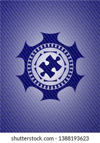 jigsaw puzzle piece icon inside emblem with jean high quality background