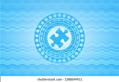 jigsaw puzzle piece icon inside water wave badge.