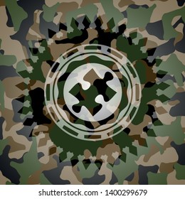 jigsaw puzzle piece icon inside camouflaged emblem