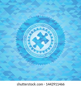 jigsaw puzzle piece icon inside sky blue emblem with triangle mosaic background
