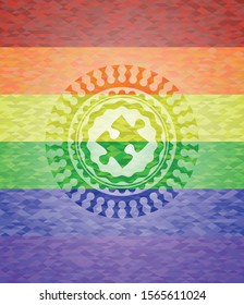 jigsaw puzzle piece icon inside emblem on mosaic background with the colors of the LGBT flag