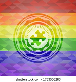jigsaw puzzle piece icon inside emblem on mosaic background with the colors of the LGBT flag. 