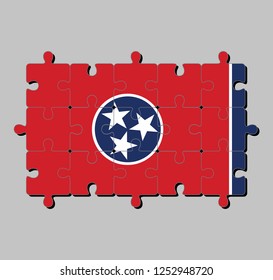 Jigsaw puzzle of Tennessee flag in blue circle with three white stars on red rectangular, with a strip of white and blue. Concept of Fulfillment or perfection. 