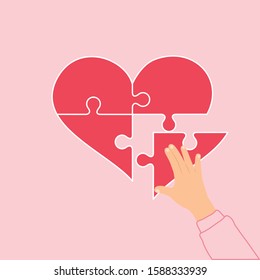 Jigsaw is shaped like heart, connection to love, valentine day with a jigsaw shape heart concept.