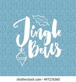 Jingle all the way. Christmas card with song quote. Brush calligraphy on blue knitted background.