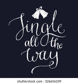 Jingle all the way. Christmas song inspirational quote with bells, vector calligraphy for greeting cards at vintage blue background