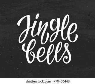 Jingle Bells white text on black chalkboard background. Modern calligraphy lettering for season greetings. Vector vintage greeting card