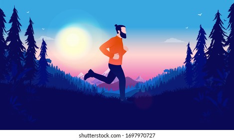 Jogging in landscape - Hipster man jogging outdoors in a forest landscape. Sunset in background with mountains and pink sky. Exercise, freedom and fitness concept.
