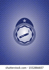 joint, cigarette icon inside badge with denim background