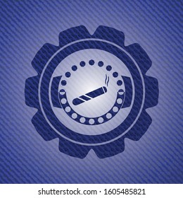 joint, cigarette icon inside badge with jean texture