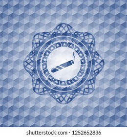 joint, cigarette icon inside blue badge with geometric pattern.