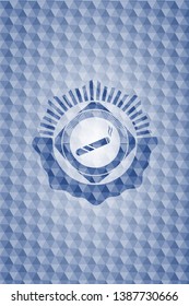 joint, cigarette icon inside blue emblem with geometric pattern.