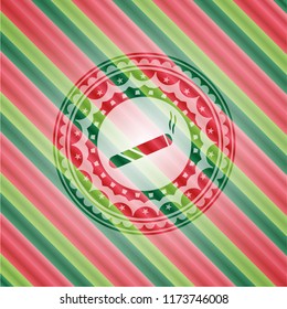 joint, cigarette icon inside christmas colors emblem.