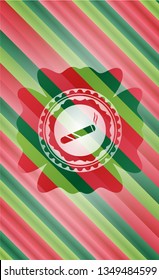 joint, cigarette icon inside christmas colors emblem.