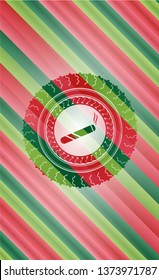 joint, cigarette icon inside christmas colors emblem.