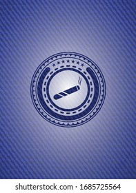 joint, cigarette icon inside denim background
