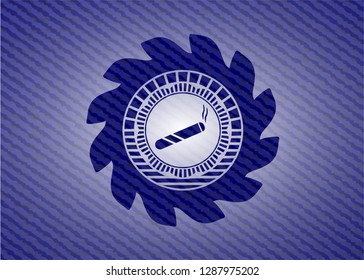 joint, cigarette icon inside emblem with jean background