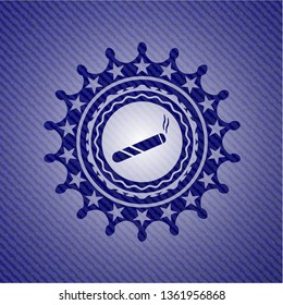 joint, cigarette icon inside emblem with jean background