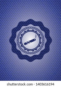 joint, cigarette icon inside emblem with jean background