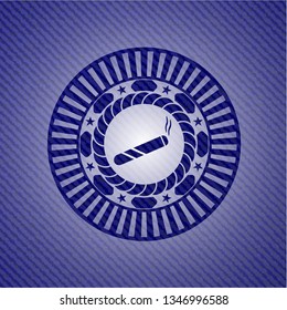joint, cigarette icon inside jean or denim emblem or badge background