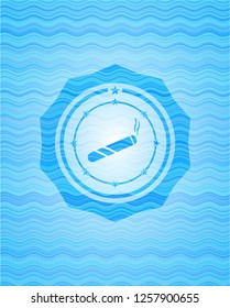 joint, cigarette icon inside light blue water style badge.